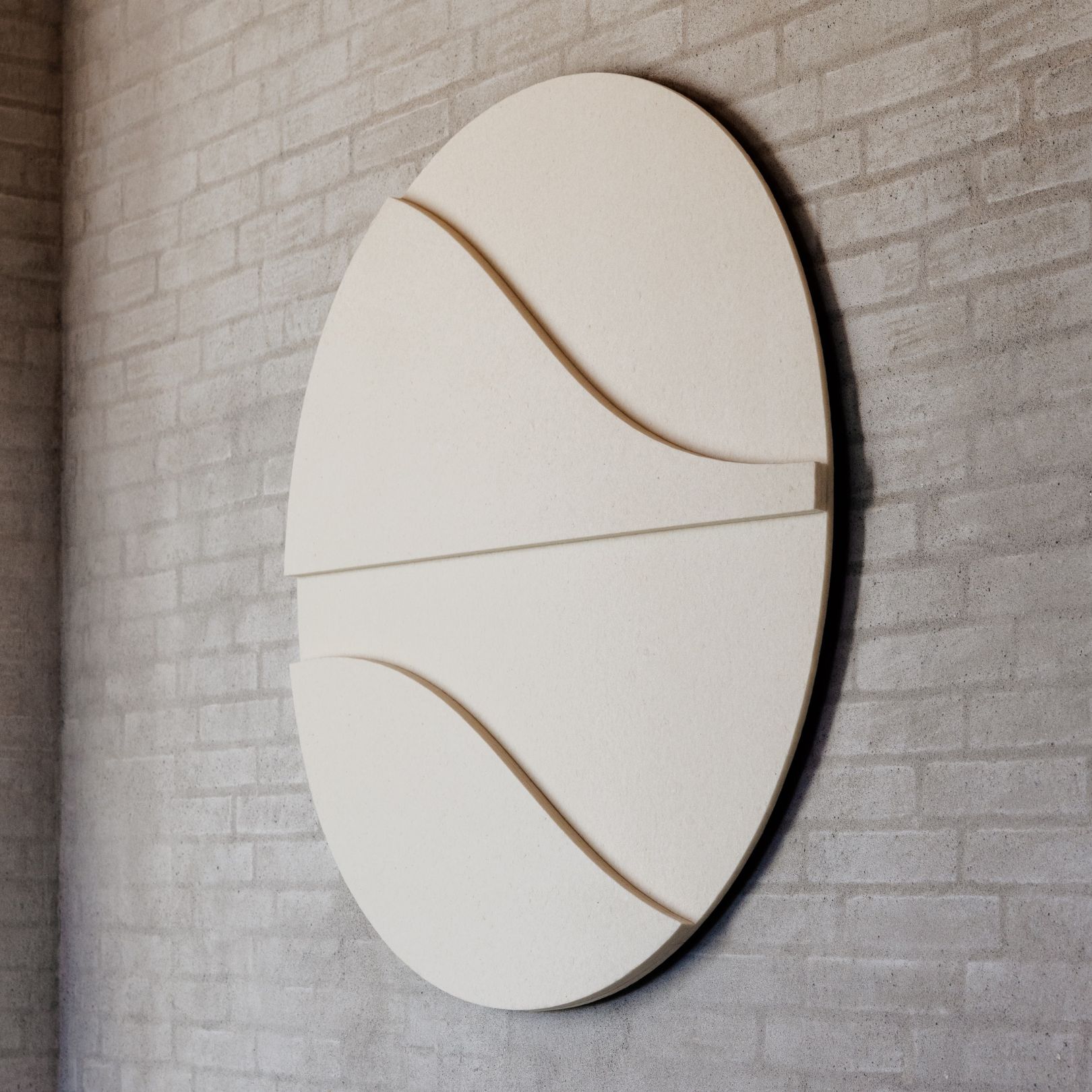 Round acoustic picture panel by Arturel x Mandalaki, made from recycled textiles, combining sound absorption with design.